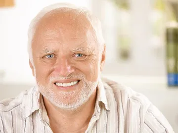 Awkward smiling old man