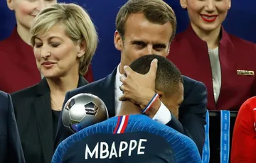 Mbappe Macron and a buggy flag