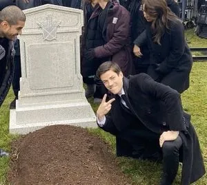 man disrespecting grave