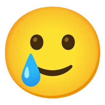 Smiling face with tear